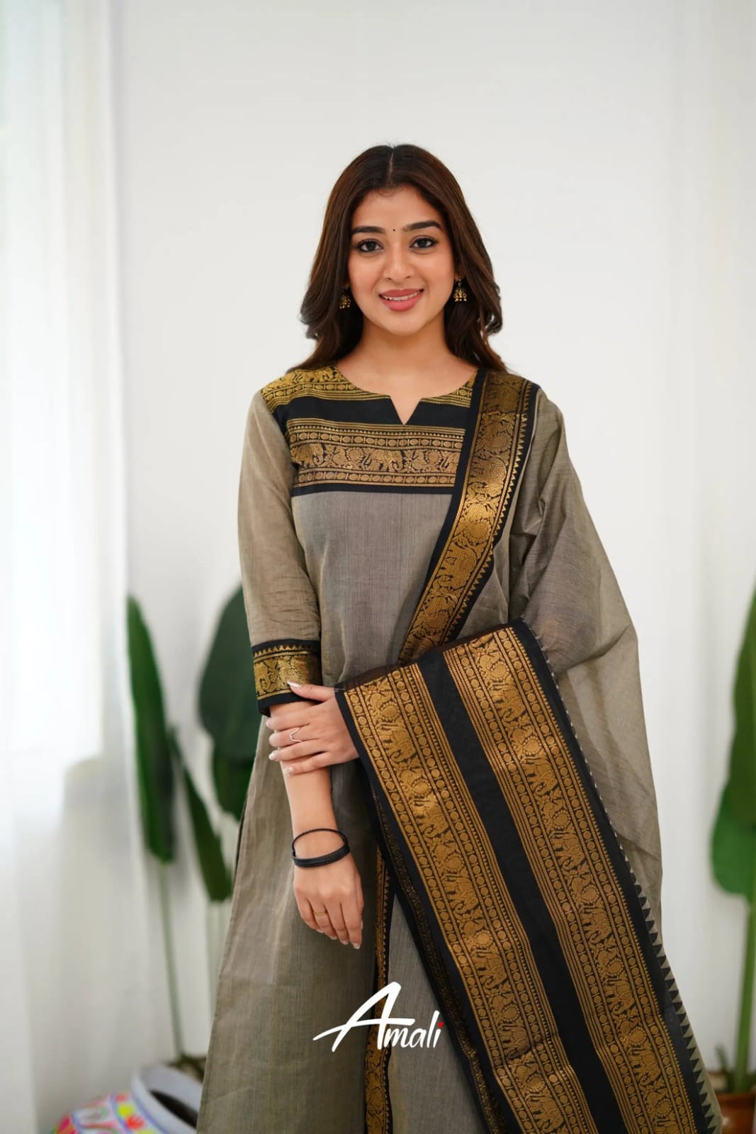 Graceful Ethnic Wear: Grey Churidar Suit with Rich Gold Detailing