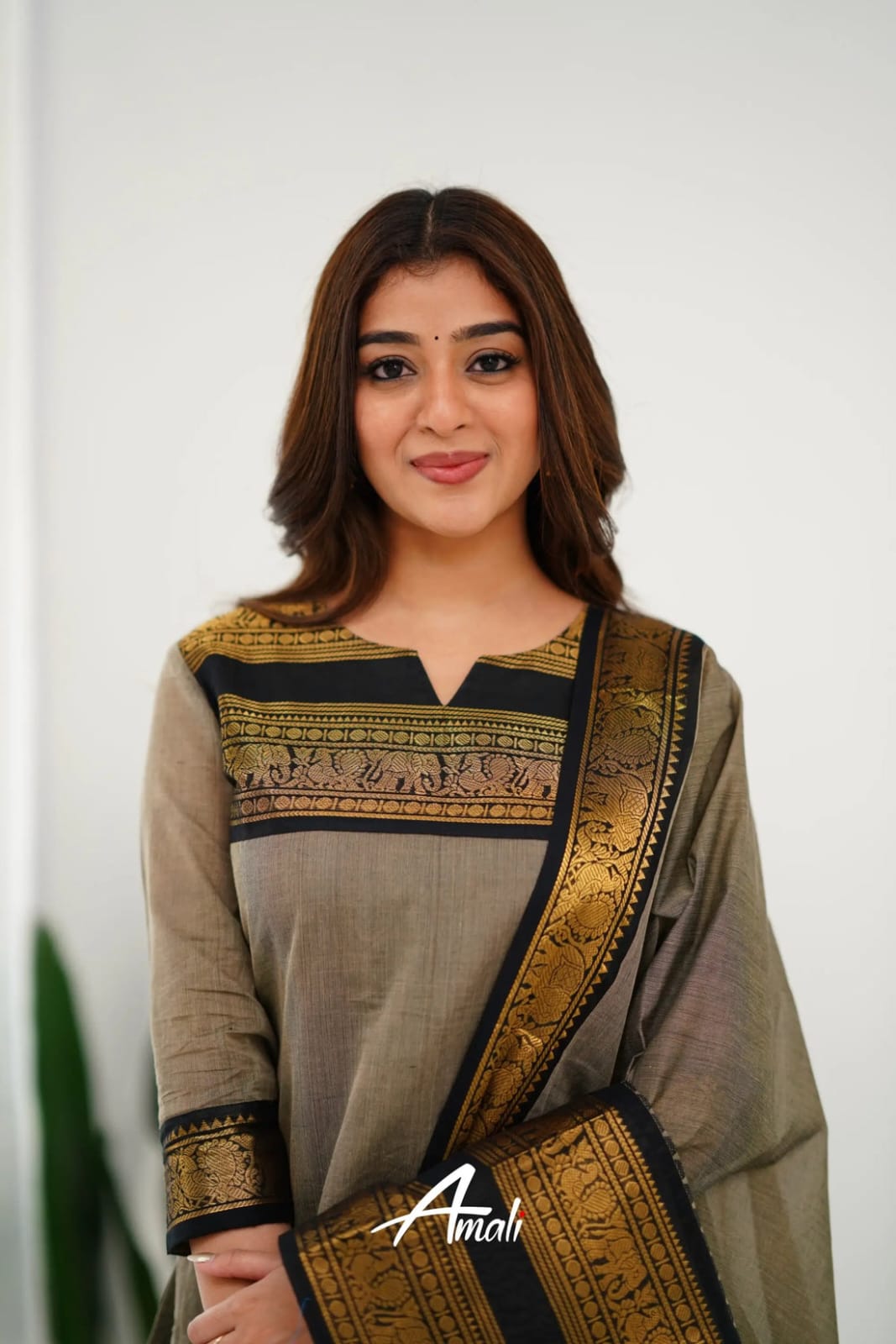 Graceful Ethnic Wear: Grey Churidar Suit with Rich Gold Detailing